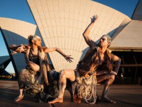 Two Indigenous Bangarra dancers outside Sydney Opera House
