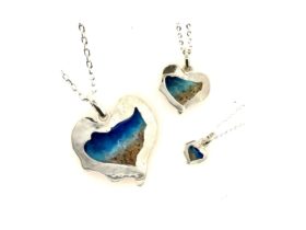 Hand made Heart of the Reef jewellery featuring Airlie Beach sand, available in various designs