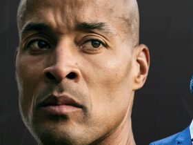 Photo of David Goggins with a serious emotion on his face behind a black background